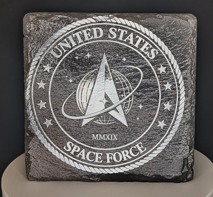 Laser engraved military logo on square natural slate coaster, view 1